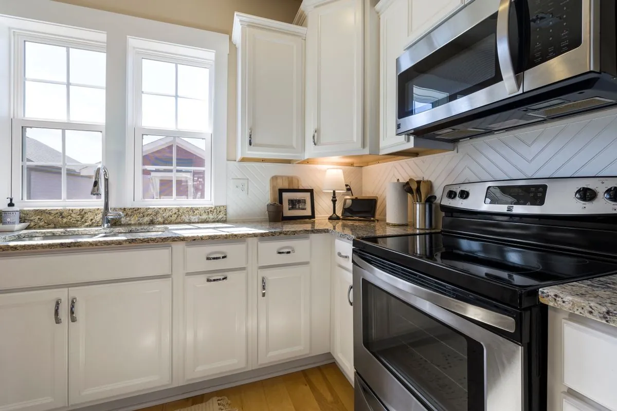 Kitchen with stainless range and over-the-range microwave