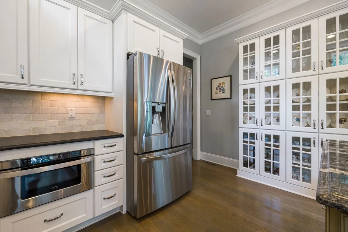 Upscale kitchen with French-door stainless refrigerator